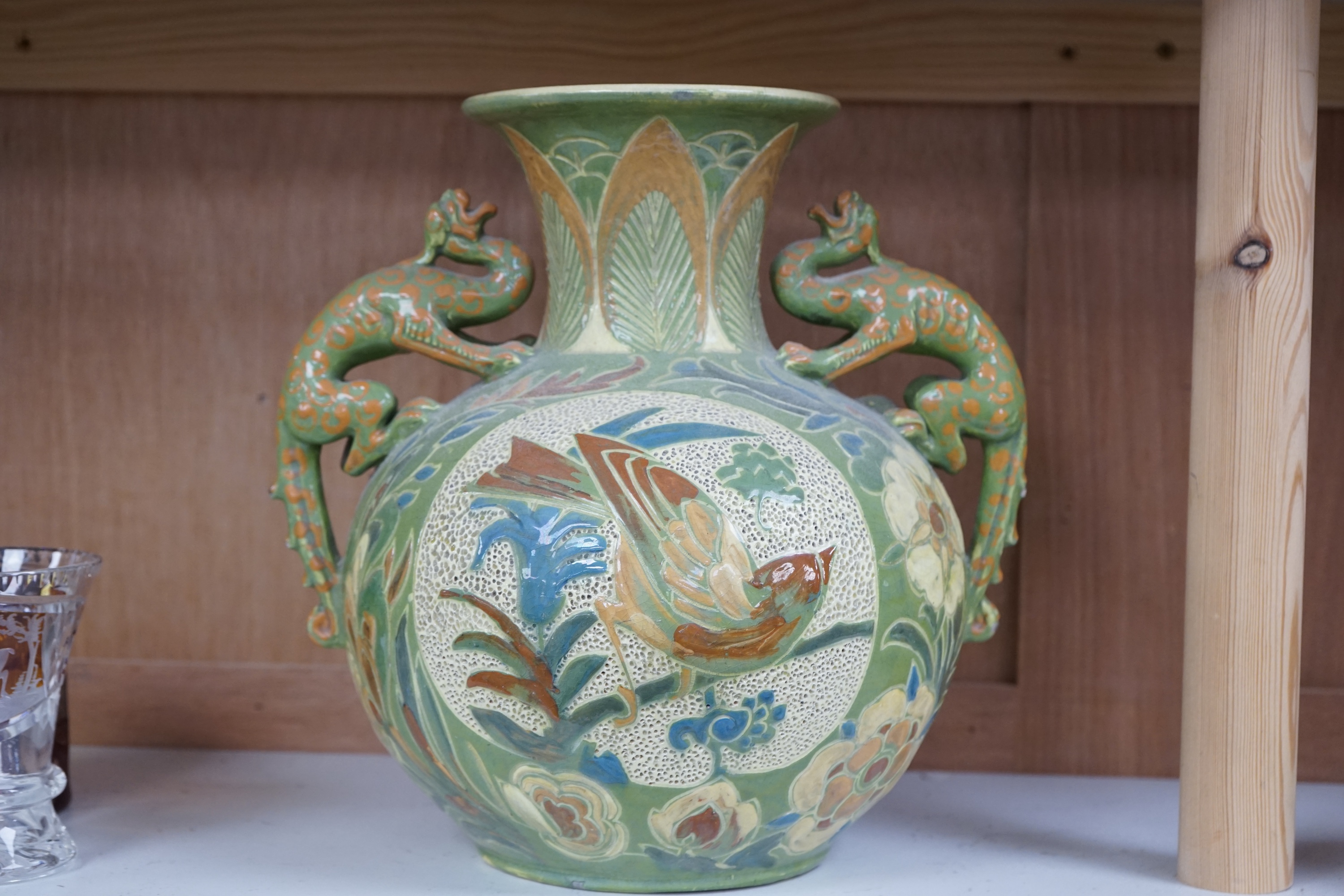 A Brannam, Barnstaple Devon, twin dragon handled vase, signed, 28cm high. Condition - fair